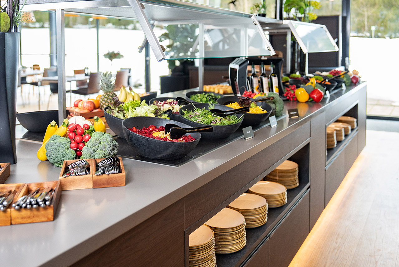 A laid table with Viennese Schnitzel on it.