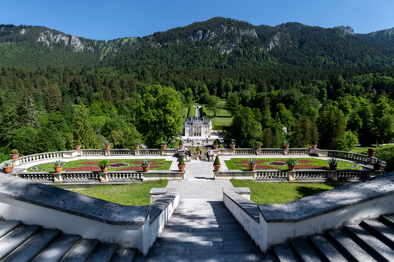 panoramic view of a beautifully landscaped garden with steps and greenery