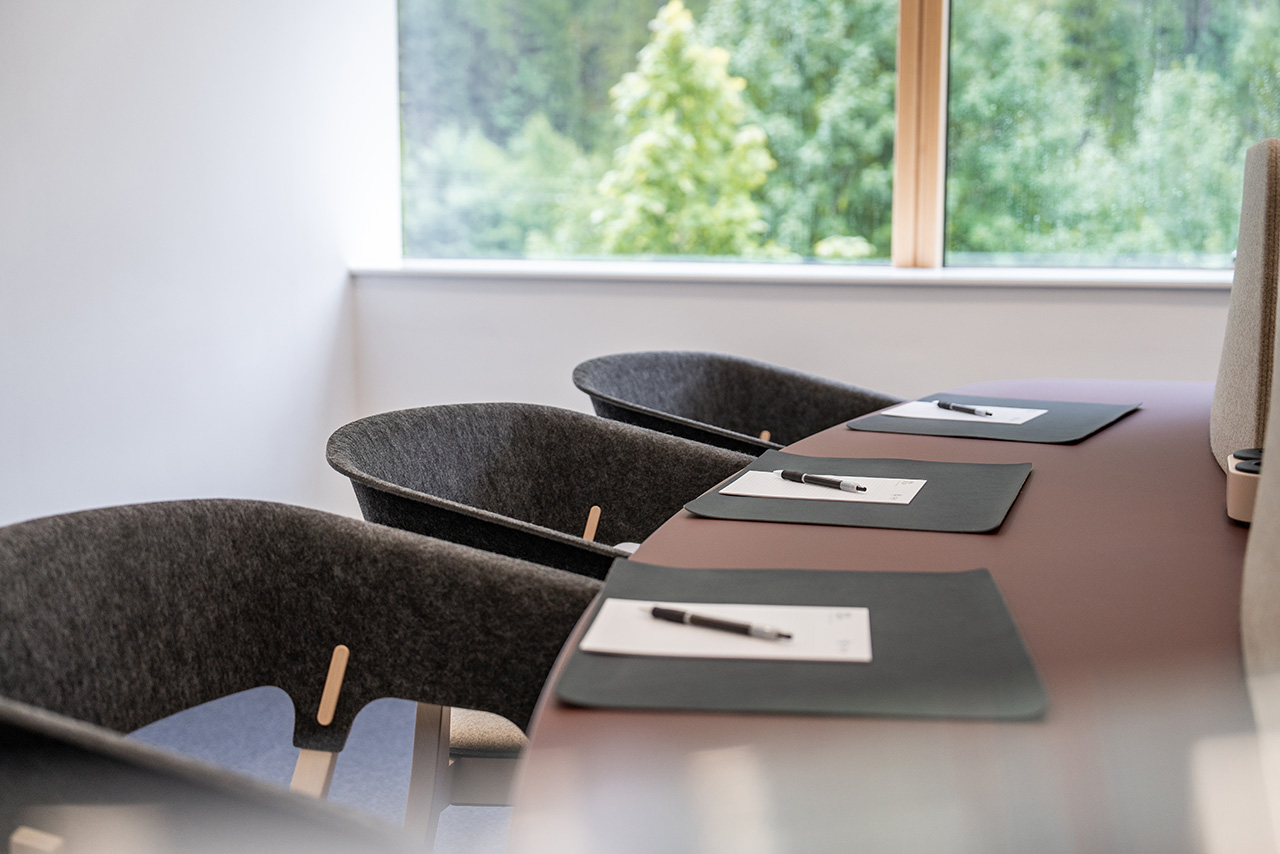 Three workshop spaces, equipped with paper and pens.