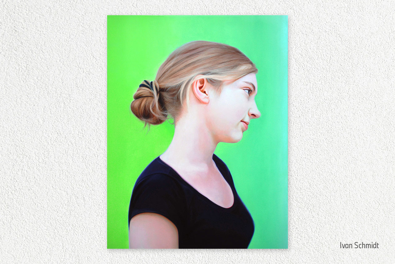 A side profile portrait of a young woman with a bun hairstyle against a vibrant green background.