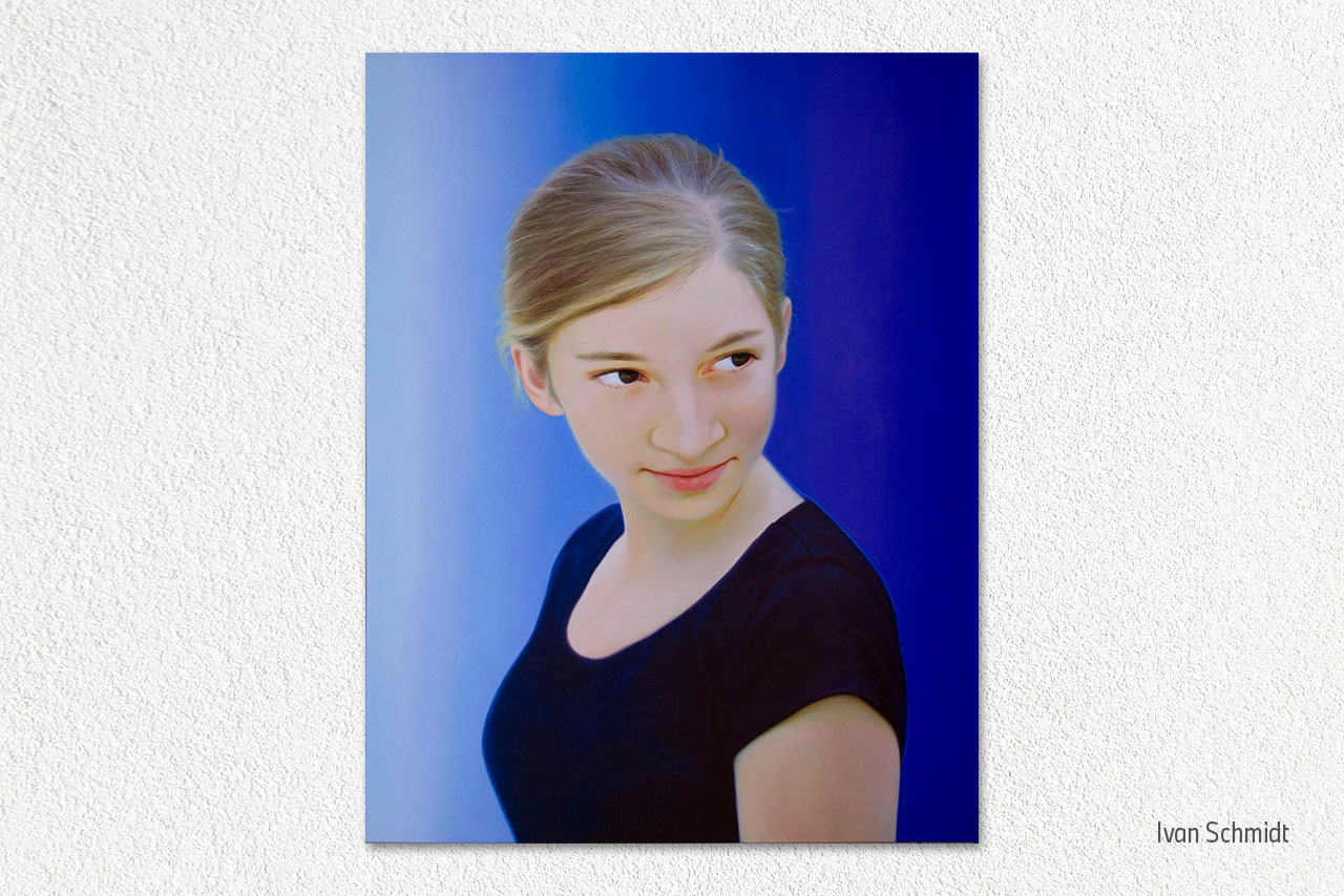 A portrait of a young girl with a blue background, showcasing her thoughtful expression.